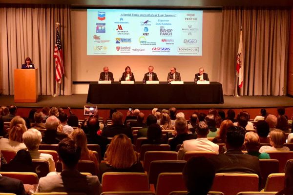 auditorium room with chairs and panel
